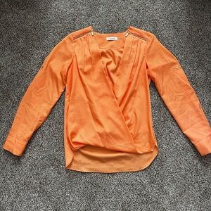 Women’s Calvin Klein small orange long sleeve shirt